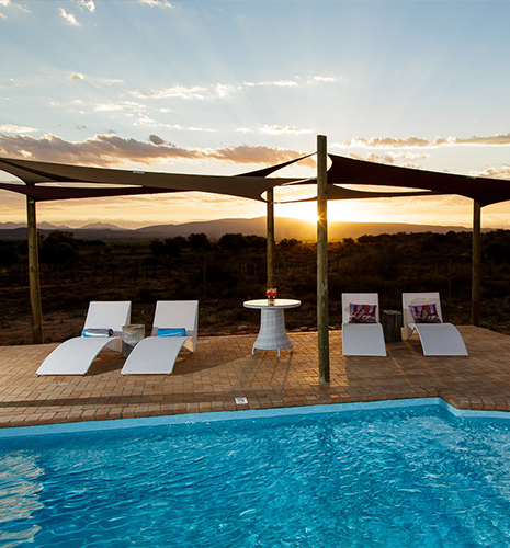 stone-cottage-pool-lounge-chairs