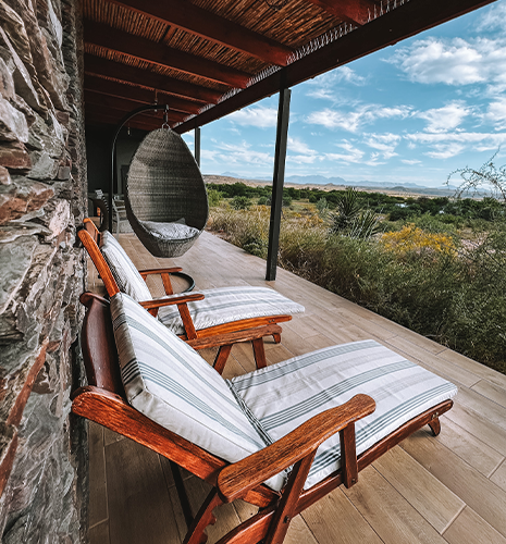 stone-cottage-porch-lounge-chairs